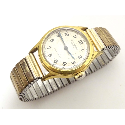 773 - A mid 20thC Bravington's 'Wetrista' wrist watch, together with a ladies' Art Deco wrist watch by Rek... 