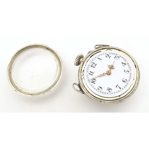 781 - A late 19thC / early 20thC small bulls eye style pocket watch with glazed front and back with white ... 