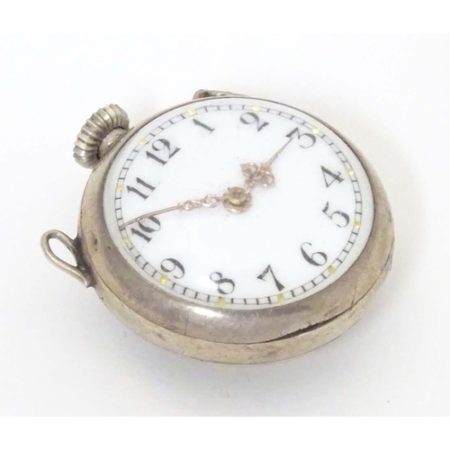 781 - A late 19thC / early 20thC small bulls eye style pocket watch with glazed front and back with white ... 