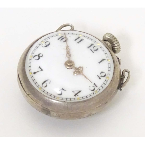 781 - A late 19thC / early 20thC small bulls eye style pocket watch with glazed front and back with white ... 