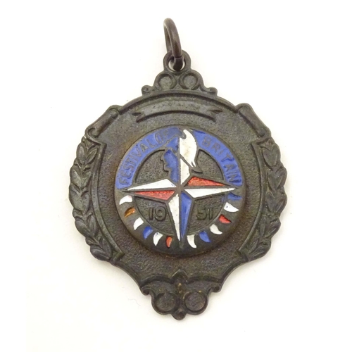 782 - A Festival of Britain 1951 fob with enamel decoration. Together with a pocket watch, the dial signed... 