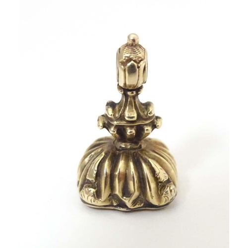 790 - A 19thC yellow metal pendant fob seal set with bloodstone seal under titled May It Be Thine. Approx.... 