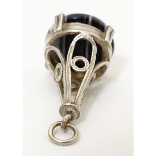 791 - A silver pendant fob seal set with banded agate under. Approx. 1 1/4