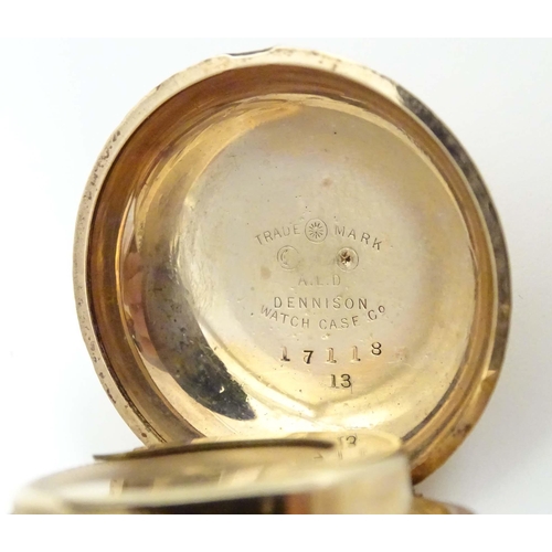 792 - A gilt metal sovereign case by A L Dennison Watch Case Company, titled to centre Made in England gol... 