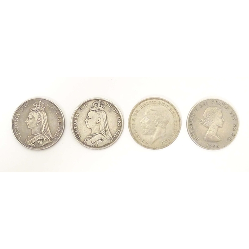 796 - Coins: Four various crowns, two Victorian 1887, 1890 crowns, a Geo V 1935 crown and an Elizabeth II ... 