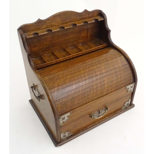 1066 - An early 20thC oak smokers companion / box with silver plate mounts, tambour front with a single fit... 