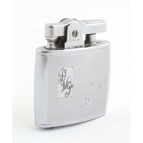 1068 - A mid 20thC cased Ronson Standard lighter, in chromed finish. Approx. 2 1/8