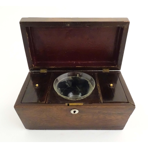 1074 - A 19thC mahogany tea caddy of sarcophagus form with mother of pearl escutcheon. The fitted interior ... 