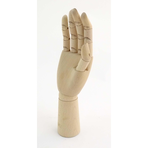 1078 - An artist's wooden articulated lay hand. Approx. 12