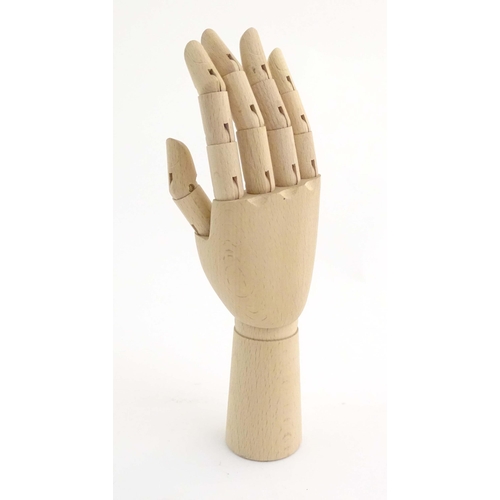 1078 - An artist's wooden articulated lay hand. Approx. 12