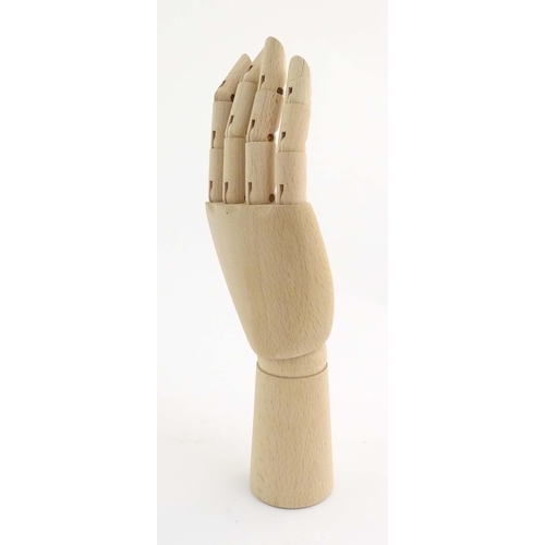 1078 - An artist's wooden articulated lay hand. Approx. 12