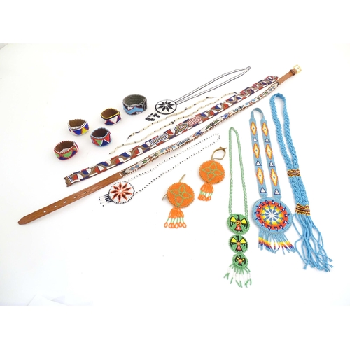 1086 - A quantity of assorted Native American bead jewellery to include disc necklaces, bracelets, belts et... 