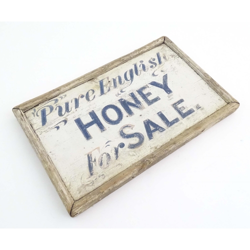 1089 - A 20thC hand painted wooden sign 'Pure English Honey For Sale'. Approx. 9