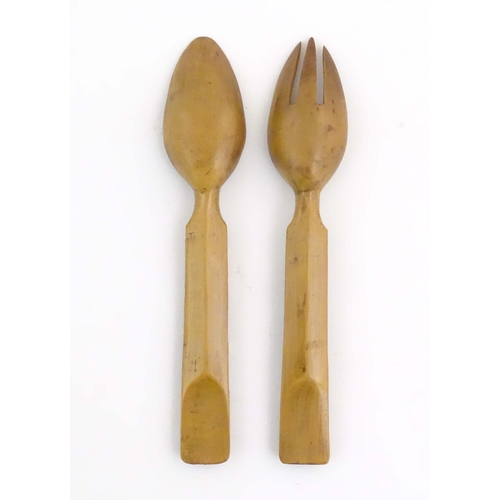 1094 - A pair of Continental carved wooden serving spoons / salad servers with stylised fruiting vine decor... 