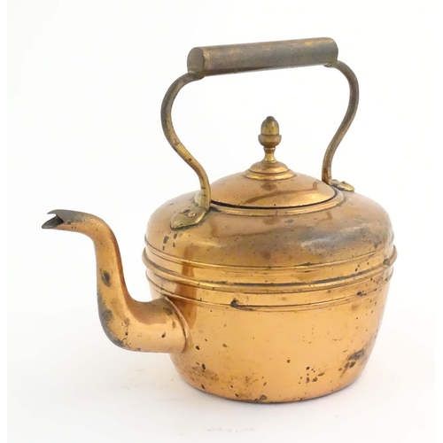 1103 - An early 20thC copper kettle, decorated with banding and acorn finial, approx. 10