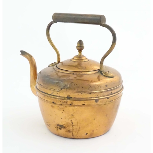 1103 - An early 20thC copper kettle, decorated with banding and acorn finial, approx. 10