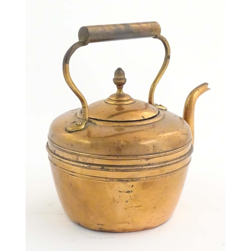 1103 - An early 20thC copper kettle, decorated with banding and acorn finial, approx. 10