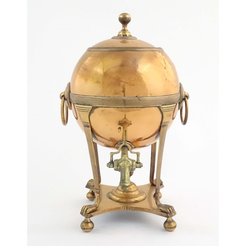 1113 - A 19thC copper samovar with spherical body, banded detail and twin ring handles, raised on four legs... 