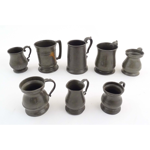 1114 - A quantity of pewter items, comprising two Victorian pint tankards, an early 20thC pint tankard, thr... 