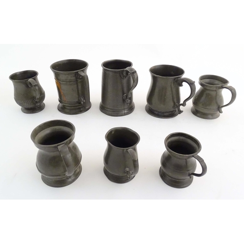 1114 - A quantity of pewter items, comprising two Victorian pint tankards, an early 20thC pint tankard, thr... 