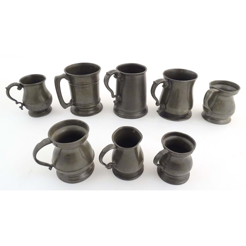 1114 - A quantity of pewter items, comprising two Victorian pint tankards, an early 20thC pint tankard, thr... 