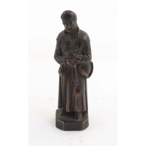 1127 - A French bronze model of Saint Benedict Joseph Labre holding a rosary. Titled to base B. Benoit Labr... 