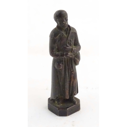 1127 - A French bronze model of Saint Benedict Joseph Labre holding a rosary. Titled to base B. Benoit Labr... 