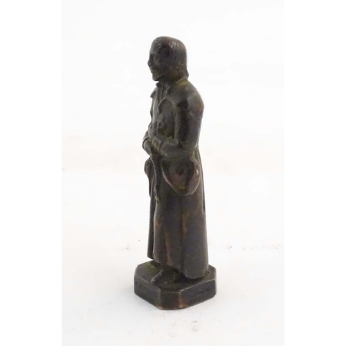 1127 - A French bronze model of Saint Benedict Joseph Labre holding a rosary. Titled to base B. Benoit Labr... 