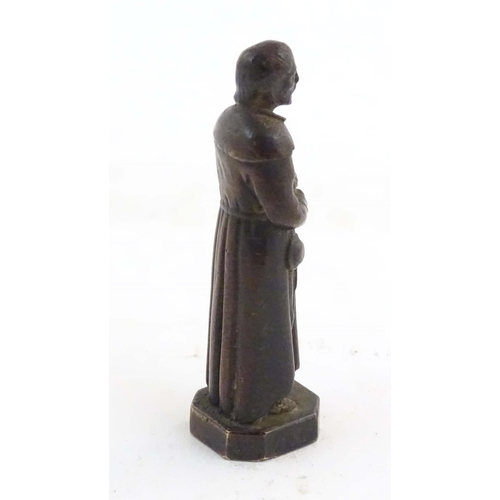 1127 - A French bronze model of Saint Benedict Joseph Labre holding a rosary. Titled to base B. Benoit Labr... 