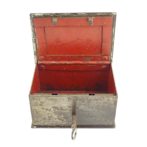 1134 - A Victorian small proportion steel strongbox of rectangular form with red painted interior. Approx. ... 