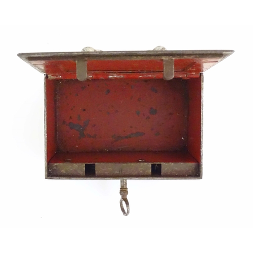 1134 - A Victorian small proportion steel strongbox of rectangular form with red painted interior. Approx. ... 