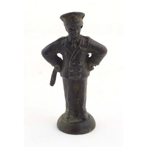 1135 - A late 19th / early 20thC cast copper pipe tamper modelled as an officer figure. Approx. 2 1/2