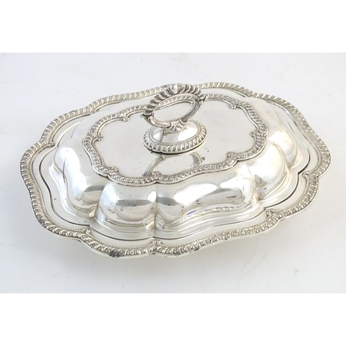 550 - A silver plate serving / entree dish and cover. Approx. 14