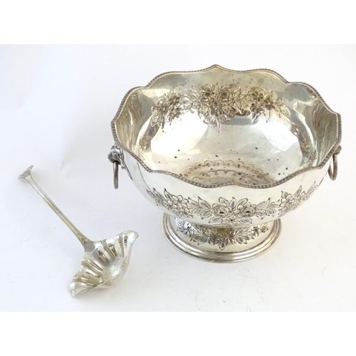 551 - A large silver plate punch bowl and ladle. The punch bowl approx. 12 1/2