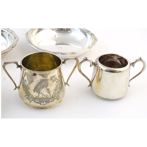 553 - Assorted silver plated wares to include a scallop shell formed butter dish, two cased christening se... 