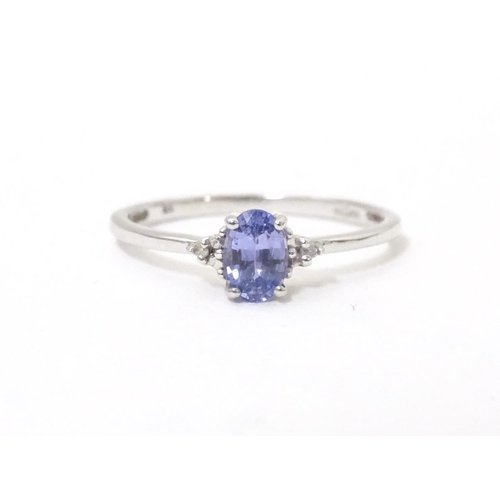 576 - A 9ct white gold ring set with tanzanite. Ring size approx. N 1/2