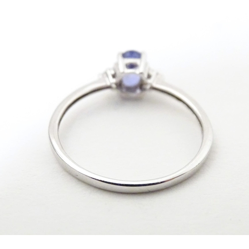 576 - A 9ct white gold ring set with tanzanite. Ring size approx. N 1/2