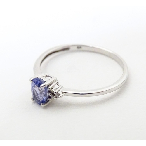 576 - A 9ct white gold ring set with tanzanite. Ring size approx. N 1/2