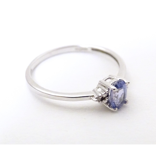 576 - A 9ct white gold ring set with tanzanite. Ring size approx. N 1/2