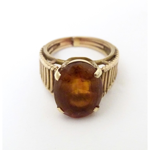 580A - A 9ct gold retro ring set with citrine, hallmarked London 1958, maker HGM. Ring size approx. M 1/2