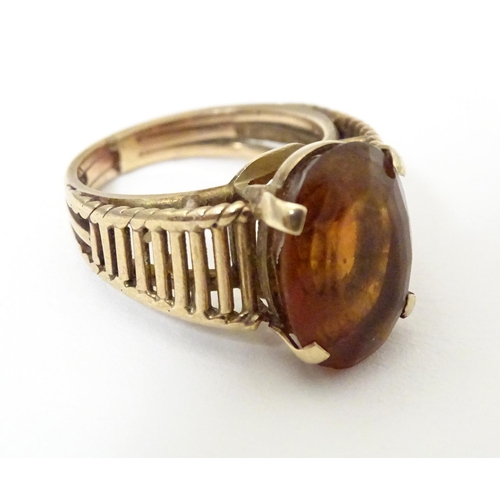 580A - A 9ct gold retro ring set with citrine, hallmarked London 1958, maker HGM. Ring size approx. M 1/2