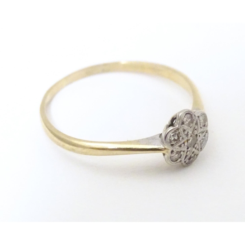 582 - A 9ct gold ring set with chip cut diamonds in a platinum setting. Ring size approx. S