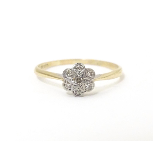 582 - A 9ct gold ring set with chip cut diamonds in a platinum setting. Ring size approx. S