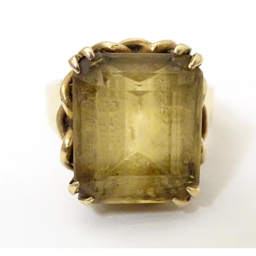 584 - A 9ct gold dress ring set with citrine. Ring size approx. P 1/2