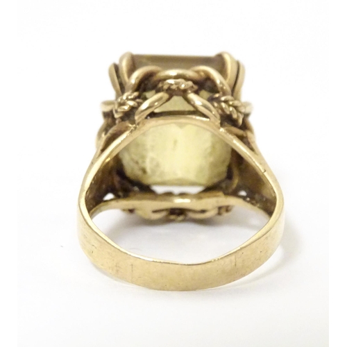 584 - A 9ct gold dress ring set with citrine. Ring size approx. P 1/2