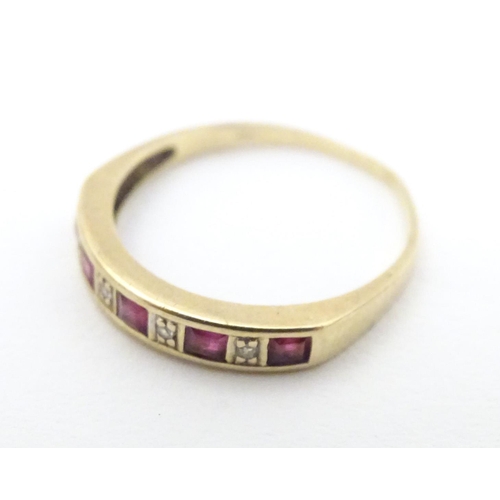 596 - A 9ct gold ring set with rubies and diamonds. Together with a 9ct gold ring set with white stones. R... 