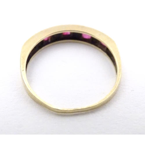 596 - A 9ct gold ring set with rubies and diamonds. Together with a 9ct gold ring set with white stones. R... 