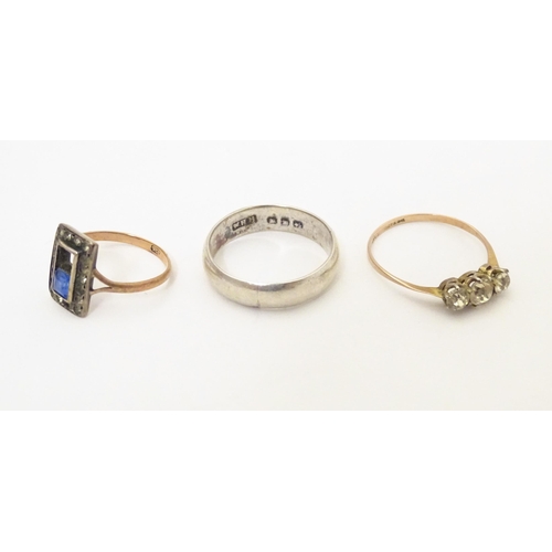 598 - Three various rings comprising a silver band, a 9ct gold ring and a 9ct gold and silver ring (3)