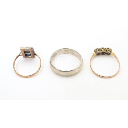 598 - Three various rings comprising a silver band, a 9ct gold ring and a 9ct gold and silver ring (3)