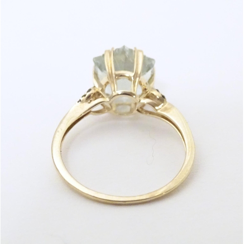 605 - A 9ct gold ring set with central prasiolite flanked by green diamonds, together with a matching pend... 